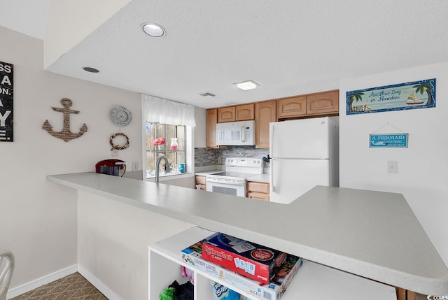 kitchen with a textured ceiling, white appliances, baseboards, light countertops, and decorative backsplash