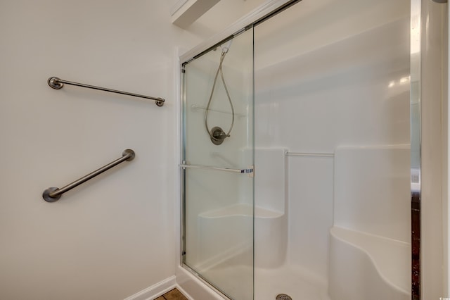 bathroom with a shower stall