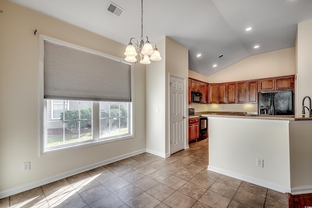 kitchen featuring visible vents, baseboards, lofted ceiling, decorative light fixtures, and black appliances