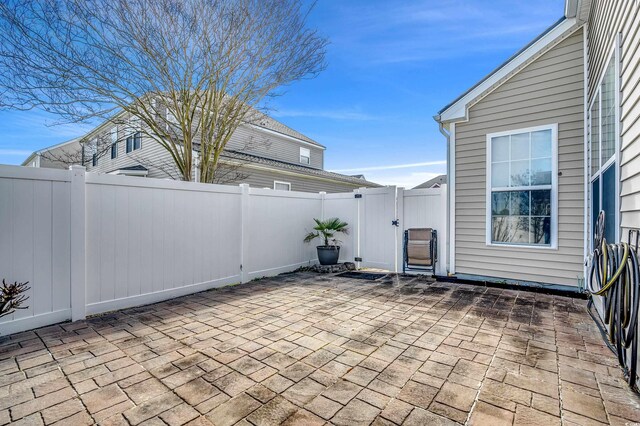 view of patio / terrace with a fenced backyard and a gate