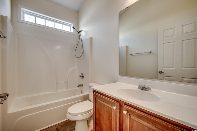 bathroom featuring toilet, tile patterned floors, shower / washtub combination, and vanity