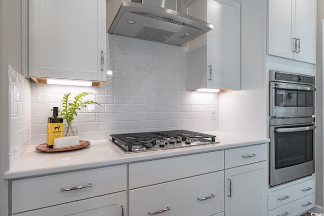 4035 Bucolic Loop, Myrtle Beach, SC 29588 - kitchen featuring exhaust hood, stainless steel appliances, light countertops, and decorative backsplash