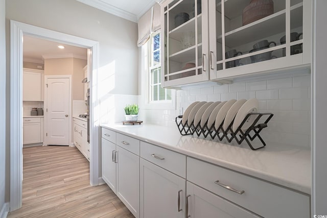 4035 Bucolic Loop, Myrtle Beach, SC 29588 - bar area featuring ornamental molding, light wood finished floors, and decorative backsplash