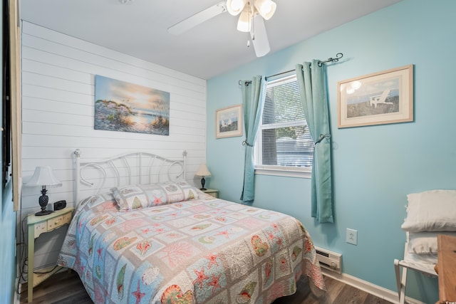 6001-1222 S Kings Hwy, Myrtle Beach, SC 29575 - bedroom with ceiling fan, baseboards, dark wood finished floors, and wood walls