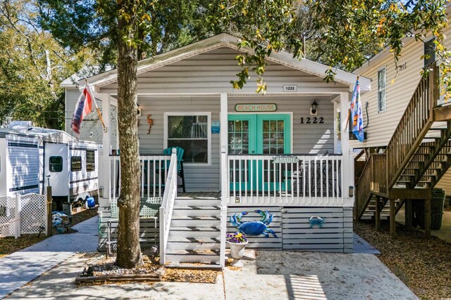 6001-1222 S Kings Hwy, Myrtle Beach, SC 29575 - view of front facade featuring stairway and covered porch