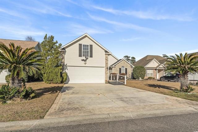 traditional home with a garage and driveway