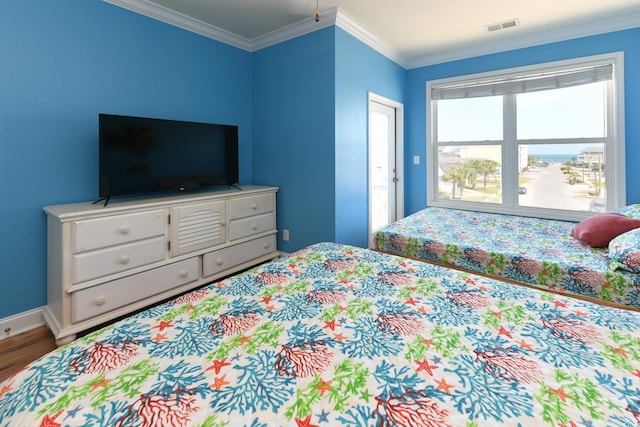 225-B Dogwood Dr N, Murrells Inlet, SC 29576 - bedroom featuring visible vents, baseboards, wood finished floors, and crown molding
