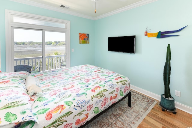 225-B Dogwood Dr N, Murrells Inlet, SC 29576 - bedroom with wood finished floors, visible vents, baseboards, ornamental molding, and access to exterior