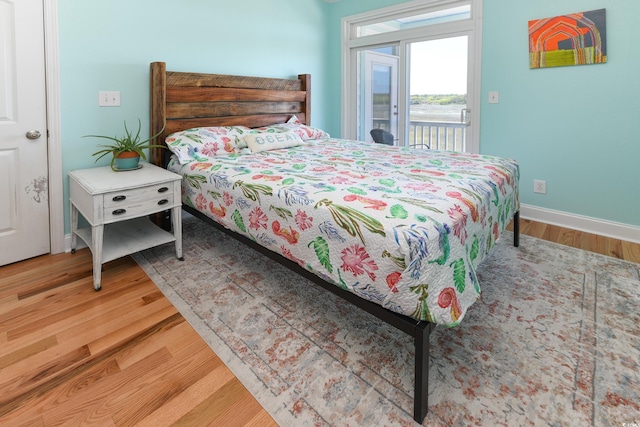 225-B Dogwood Dr N, Murrells Inlet, SC 29576 - bedroom featuring baseboards, wood finished floors, and access to exterior