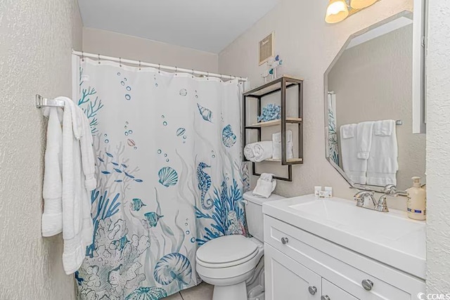 full bathroom with a shower with shower curtain, a textured wall, vanity, and toilet