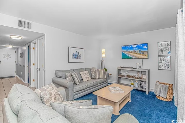 living room with carpet and visible vents