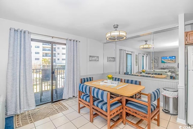 dining space with light tile patterned floors