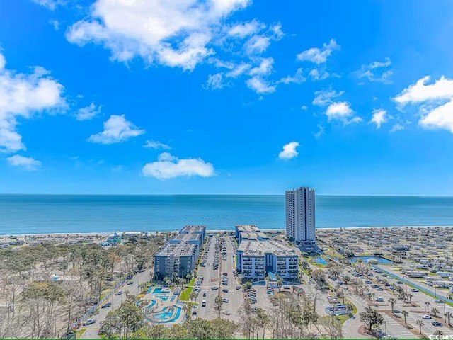 drone / aerial view featuring a water view and a city view