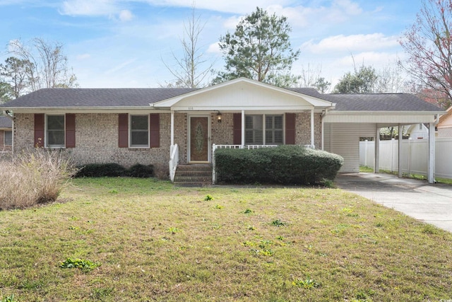 single story home with brick siding, a porch, a carport, driveway, and a front lawn