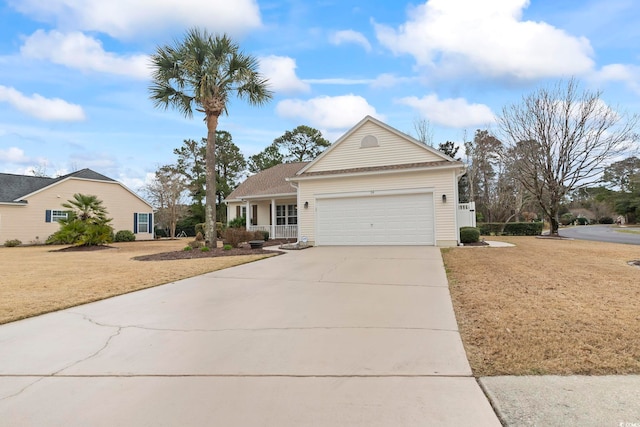 view of front of home with an attached garage, driveway, and a front yard