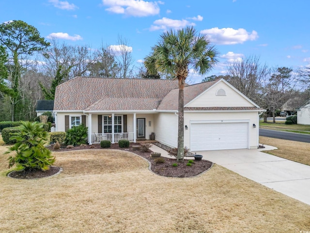 ranch-style home featuring a front lawn, covered porch, concrete driveway, and an attached garage