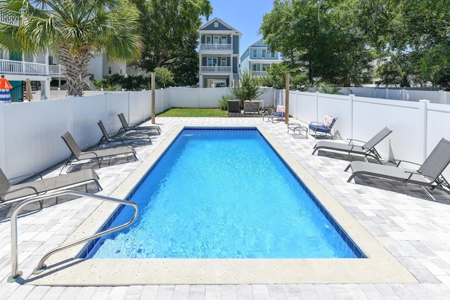 view of pool with a fenced backyard, a fenced in pool, and a patio