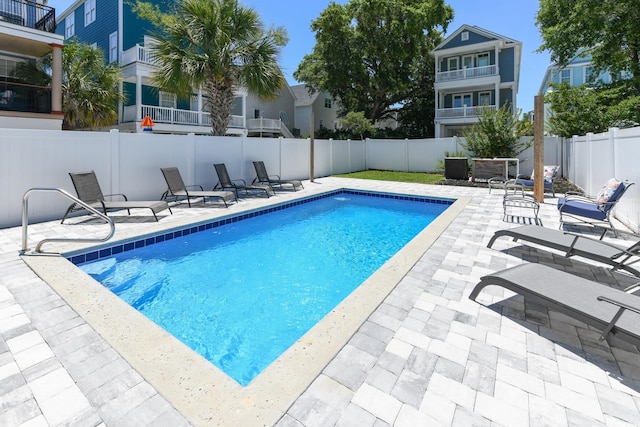 view of pool with a patio, a fenced backyard, and a fenced in pool