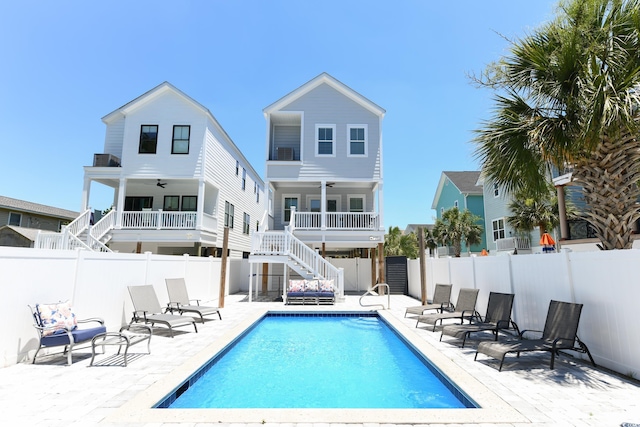 back of property with a patio, stairway, a fenced backyard, and ceiling fan