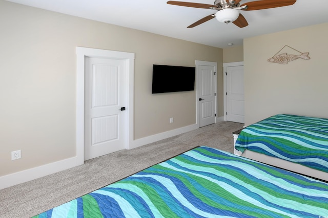 bedroom featuring baseboards, carpet, and a ceiling fan