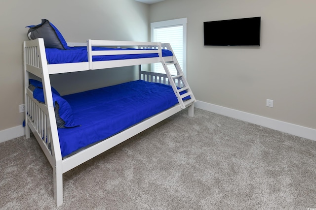 carpeted bedroom with baseboards