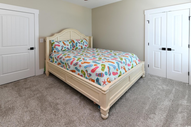 carpeted bedroom featuring a closet