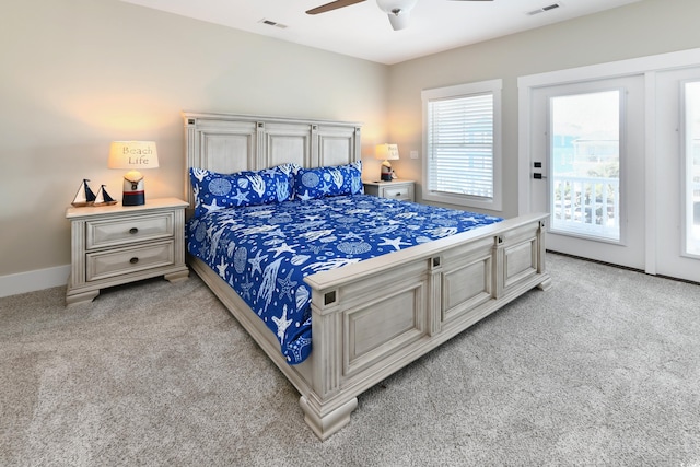 bedroom featuring visible vents, light carpet, baseboards, and access to outside