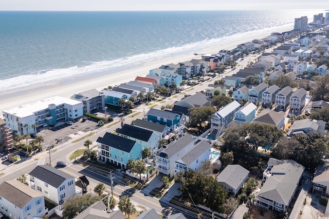 birds eye view of property featuring a residential view, a view of the beach, and a water view