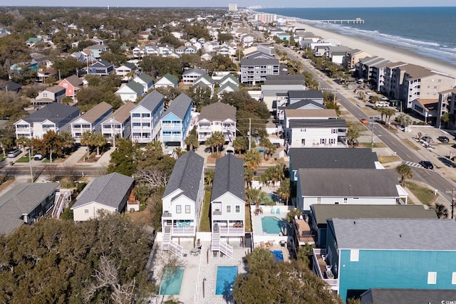 birds eye view of property featuring a residential view, a water view, and a beach view