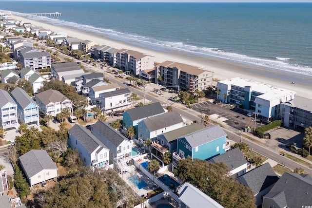 bird's eye view featuring a water view and a view of the beach