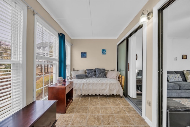 bedroom with light tile patterned floors