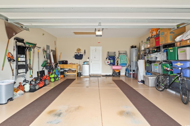 garage featuring a garage door opener and electric water heater