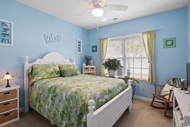 carpeted bedroom with visible vents, ceiling fan, and baseboards