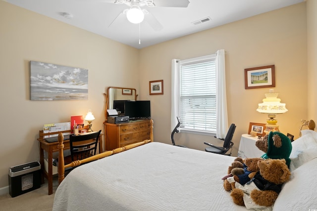 bedroom featuring visible vents, carpet floors, and ceiling fan