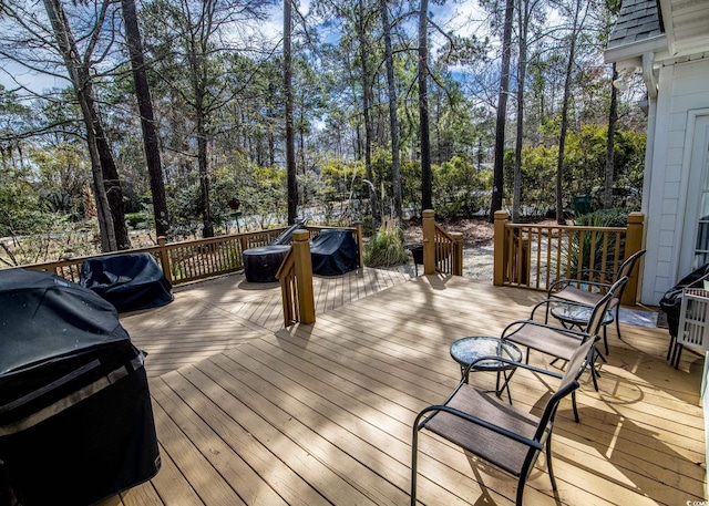 wooden deck featuring grilling area