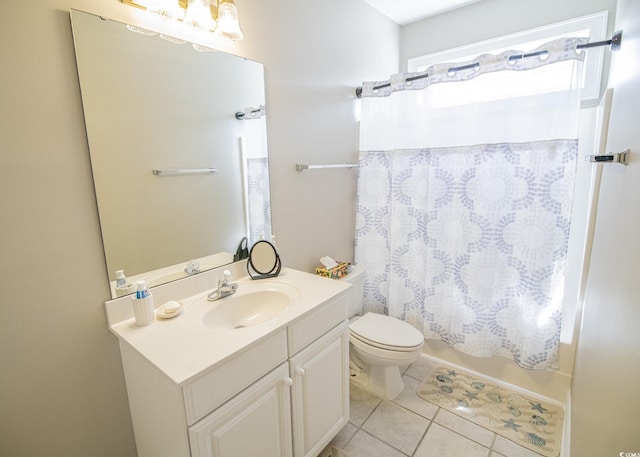 bathroom with toilet, tile patterned flooring, shower / tub combo with curtain, and vanity