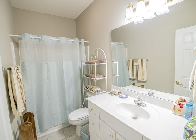 full bathroom with vanity, tile patterned flooring, and toilet