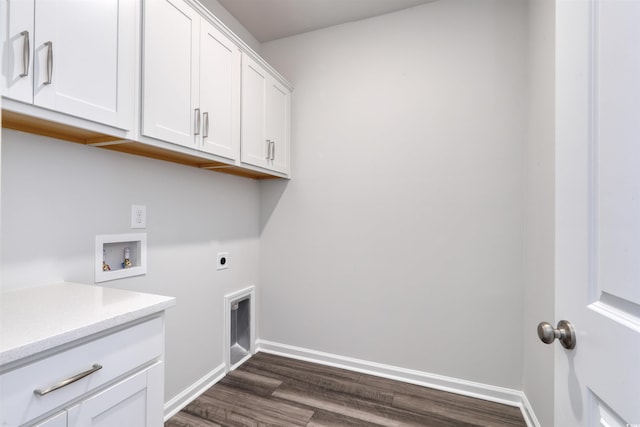 washroom with baseboards, cabinet space, dark wood-style flooring, electric dryer hookup, and washer hookup