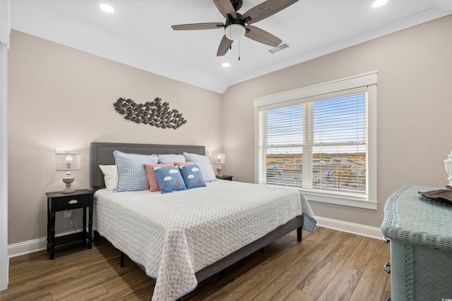 bedroom with baseboards, visible vents, wood finished floors, and recessed lighting