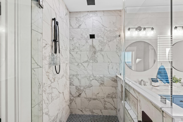 bathroom with tiled shower and visible vents