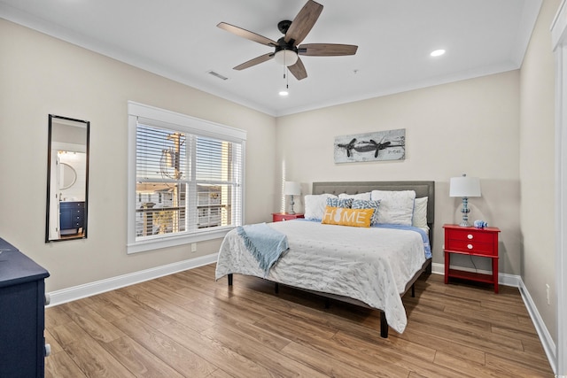 bedroom with recessed lighting, visible vents, baseboards, and wood finished floors