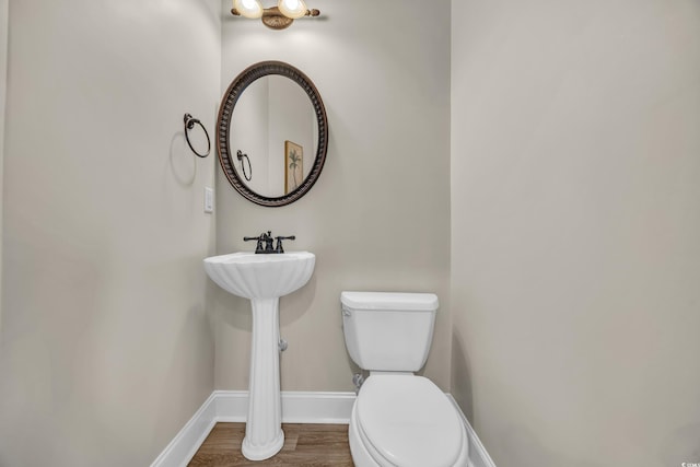 6001-MH69B S Kings Hwy, Myrtle Beach, SC 29575 - bathroom featuring toilet, baseboards, and wood finished floors