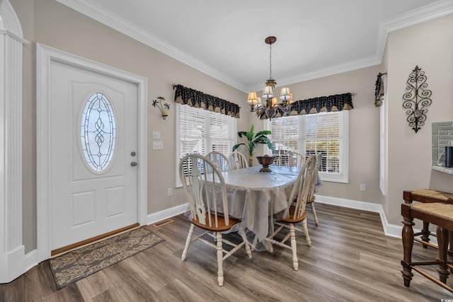 6001-MH69B S Kings Hwy, Myrtle Beach, SC 29575 - dining room featuring healthy amount of natural light, wood finished floors, a chandelier, ornamental molding, and baseboards