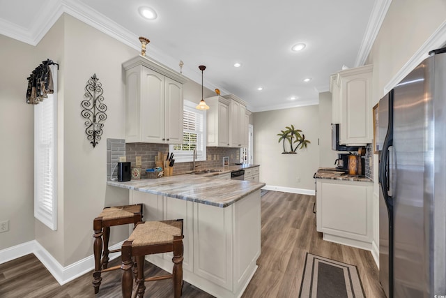 6001-MH69B S Kings Hwy, Myrtle Beach, SC 29575 - kitchen featuring freestanding refrigerator, a sink, baseboards, a peninsula, and ornamental molding