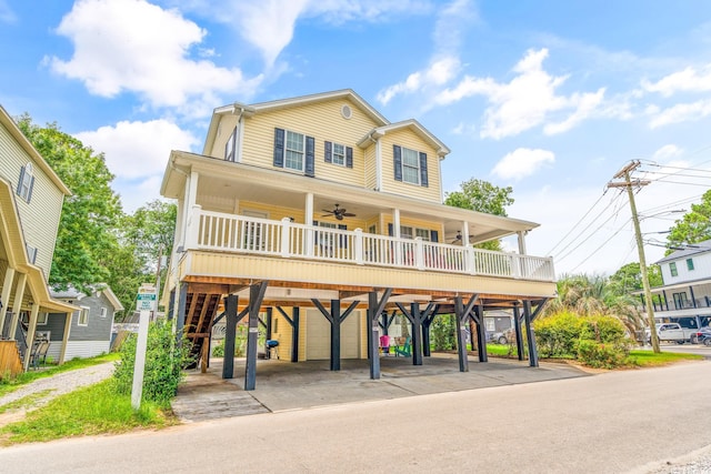 6001-MH69B S Kings Hwy, Myrtle Beach, SC 29575 - coastal home with a carport, ceiling fan, a porch, stairs, and concrete driveway