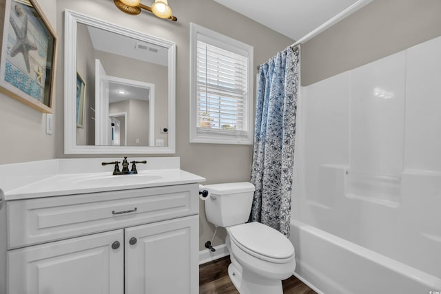 6001-MH69B S Kings Hwy, Myrtle Beach, SC 29575 - full bath featuring toilet, vanity, shower / tub combo, wood finished floors, and baseboards