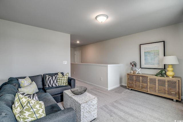 living room with recessed lighting, baseboards, and carpet floors