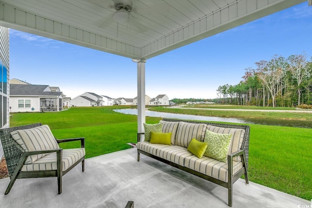 view of patio featuring a residential view, outdoor lounge area, a ceiling fan, and a water view