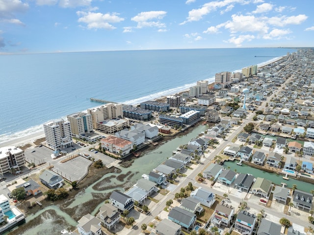 drone / aerial view featuring a water view and a city view