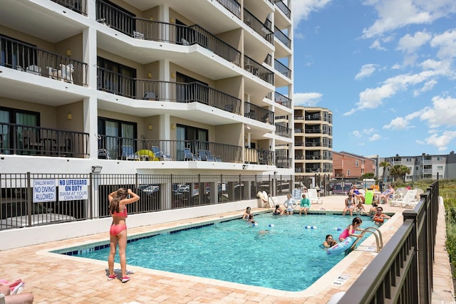 community pool with fence